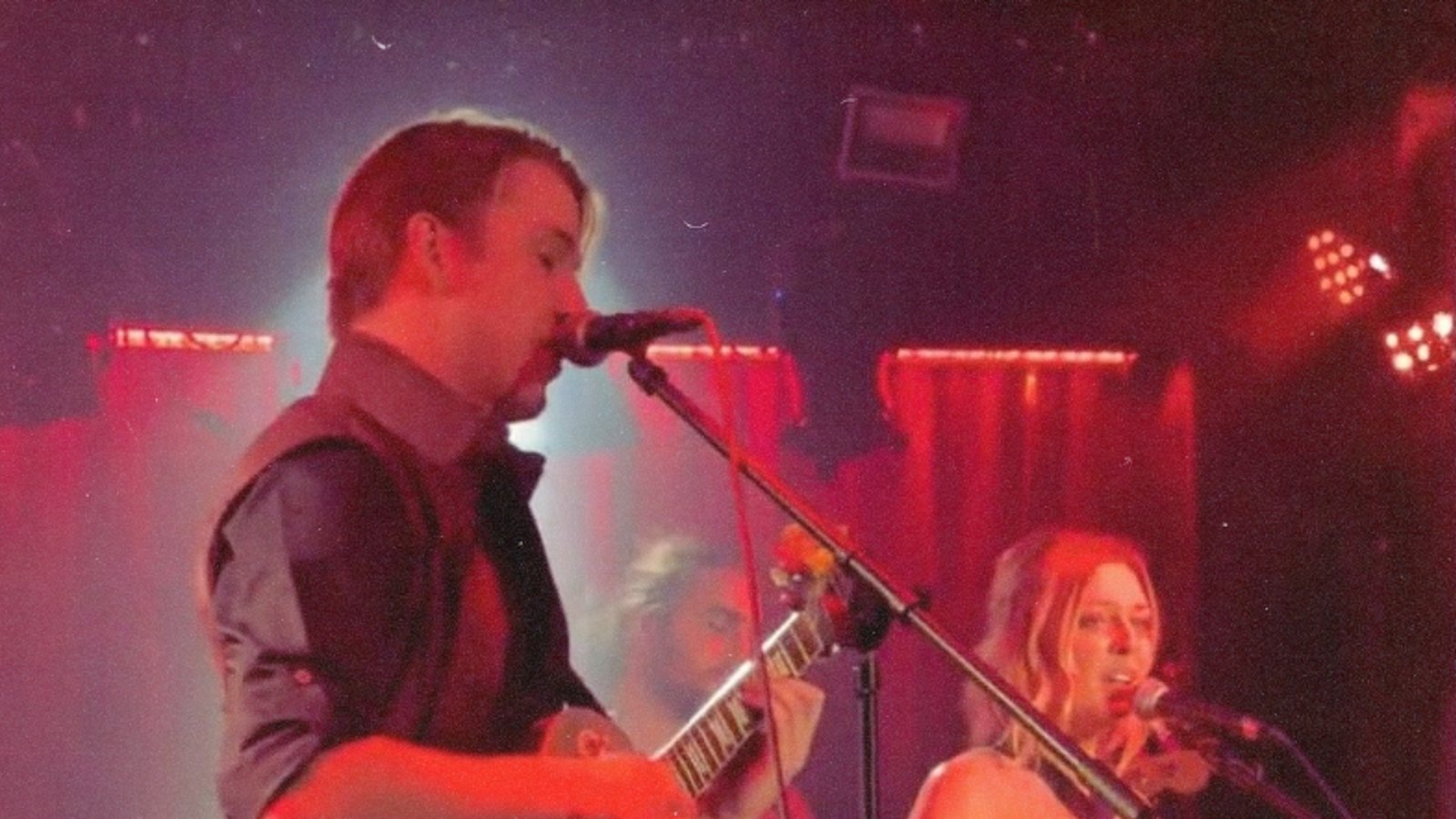 Jak on stage, backlit in a halo of white light